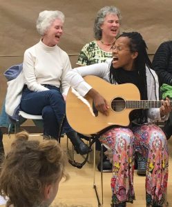 One Community image - Lea at Community Sing