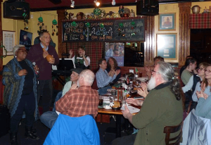 Andrea and Harold Blackford lead a song at the Pub Sing