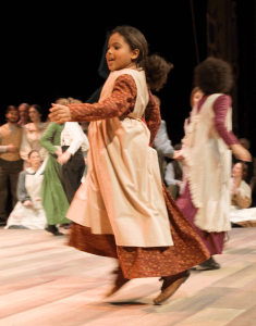 Children dancing in a Winter Revels production